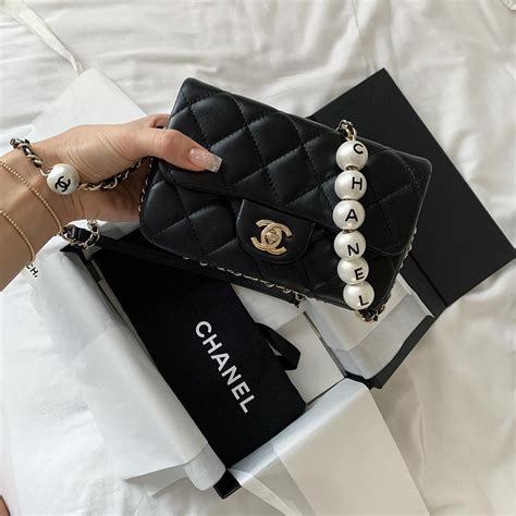 chanel bag gold chain|Chanel bag with pearl chain.